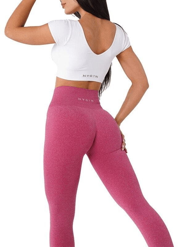 Back view of woman wearing pink tight elastic women's sports leggings for fitness, showcasing high waist and full-length fit